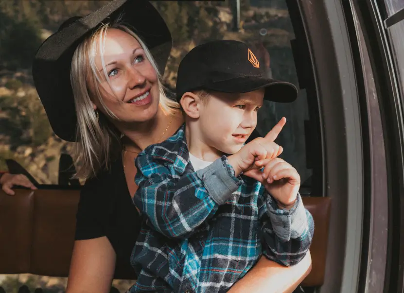 Mom and son ride the Panorama Gondola at Mammoth Mountain